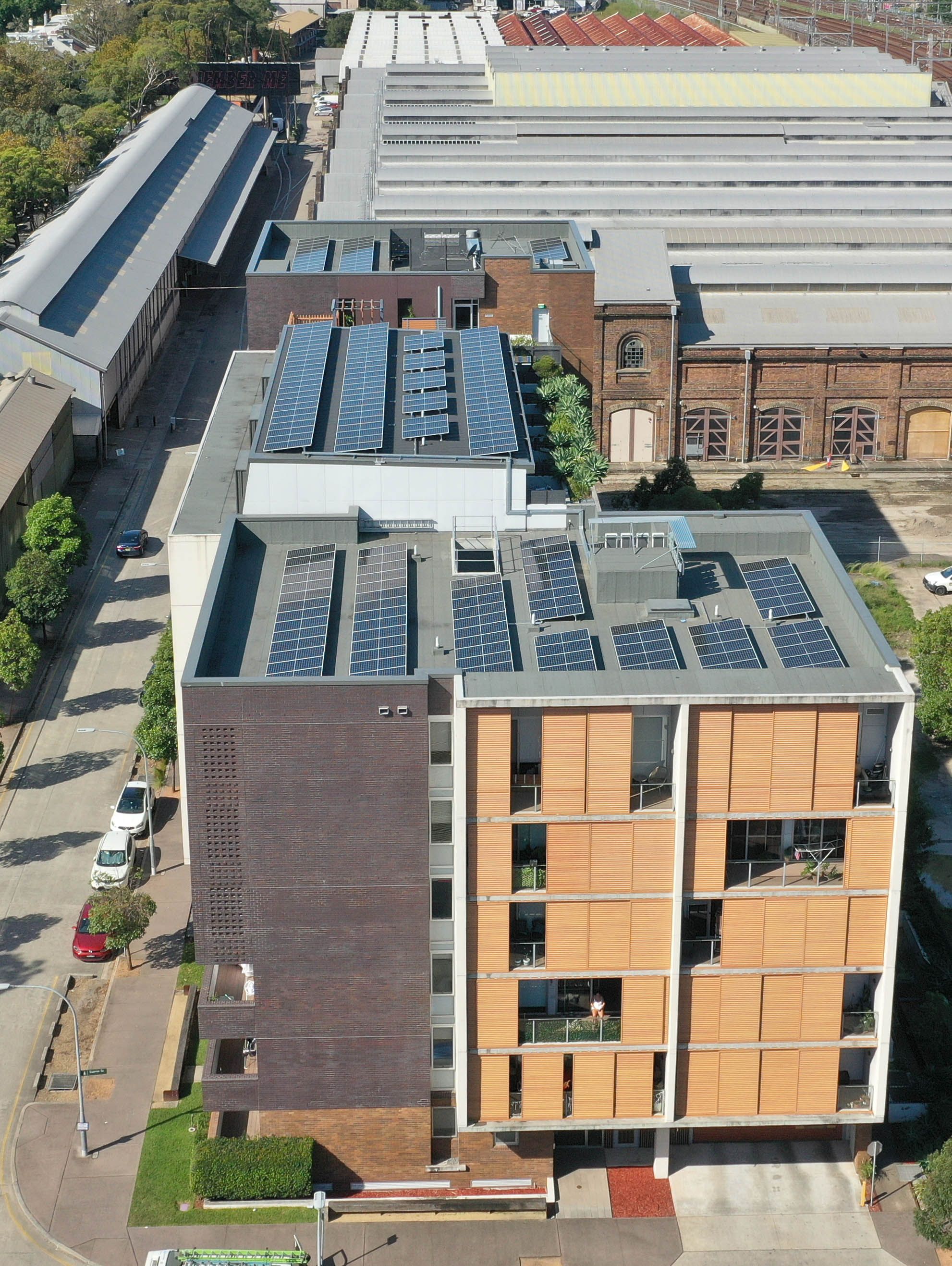 Image of 6 storey apartment building with solar panels