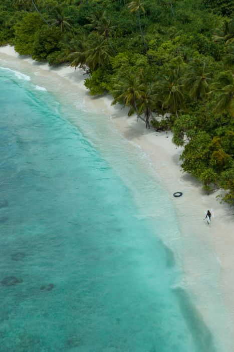 An island fringed by reef from the air