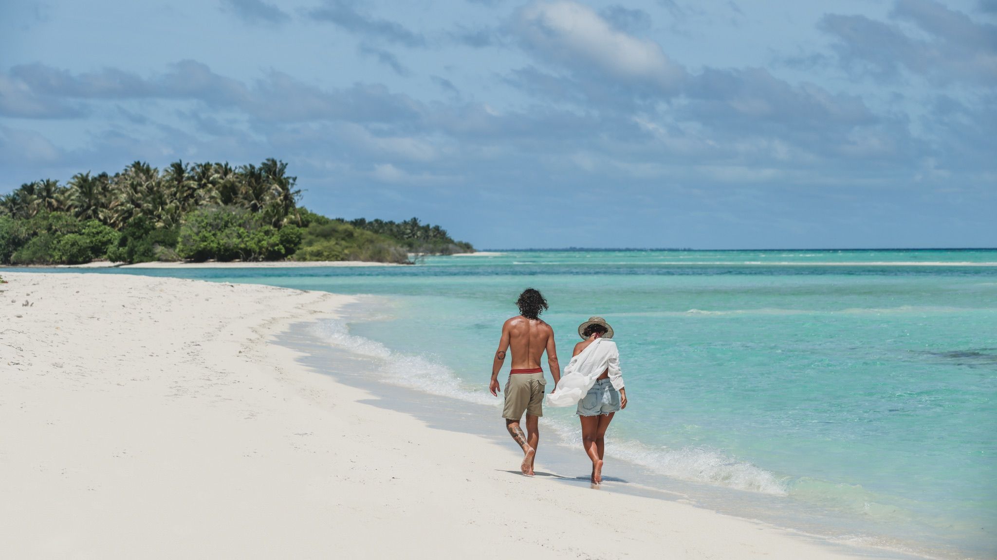 A couple walking the shoreline
