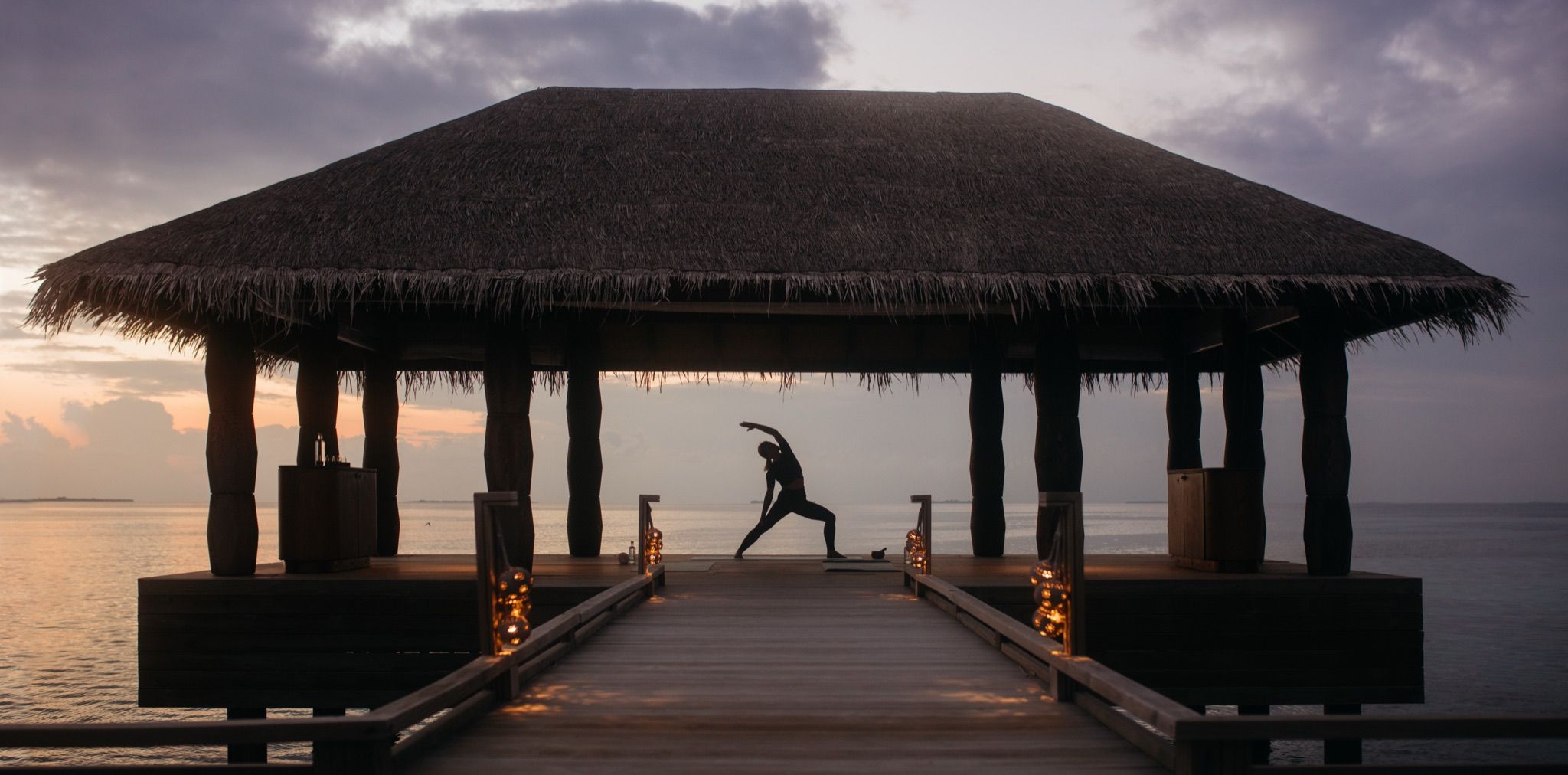 The overwater spa pavilion at dusk