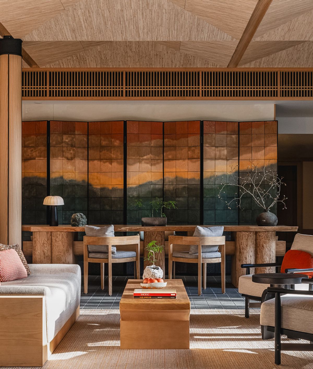 A lounge looking out through full-height glazing to the reef
