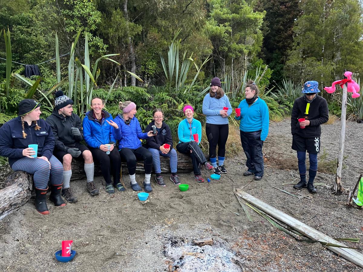 Rangatahi around a camp fire, connecting Rangatahi around a camp fire, connecting