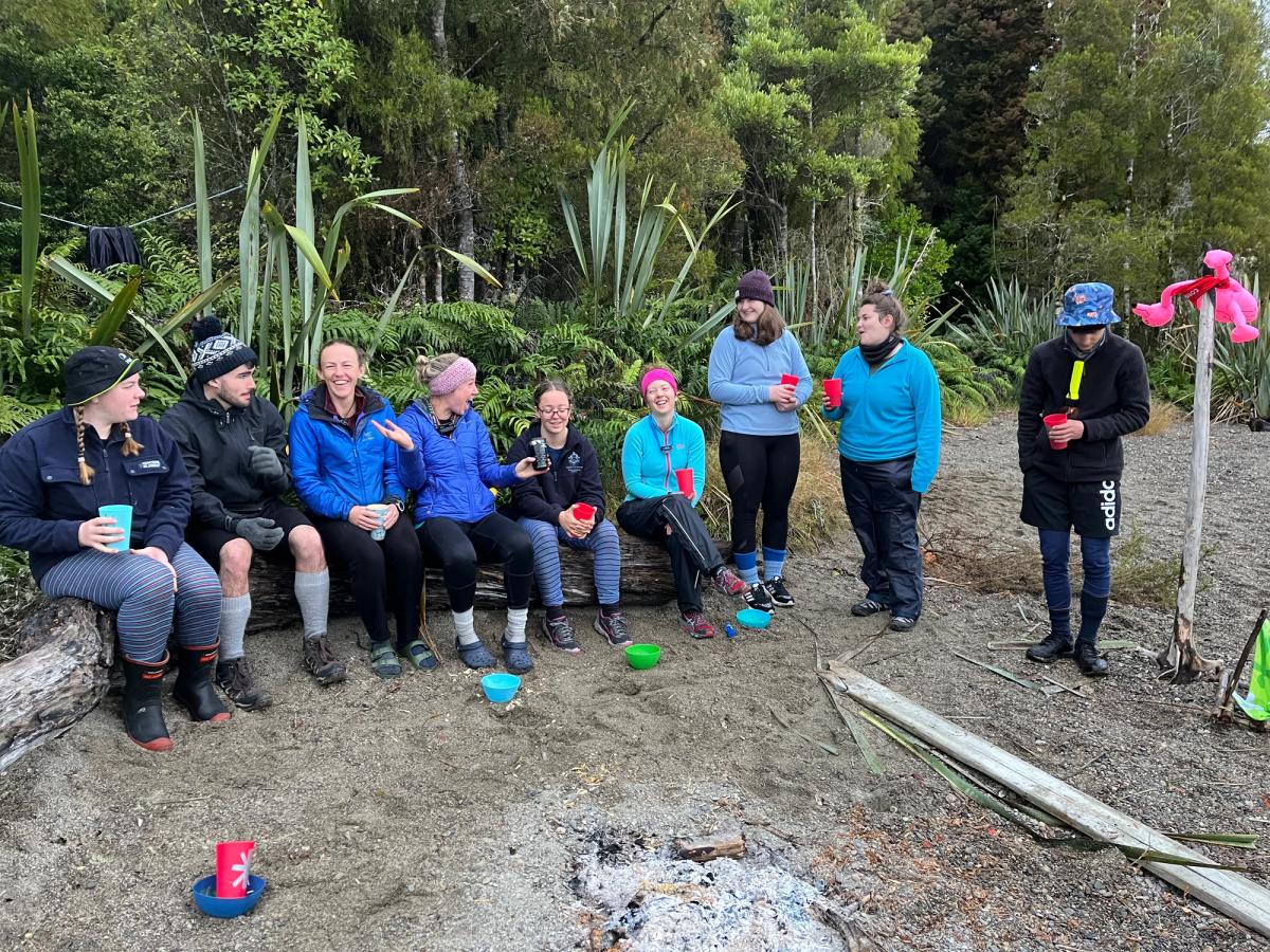 Rangatahi around a camp fire, connecting Rangatahi around a camp fire, connecting