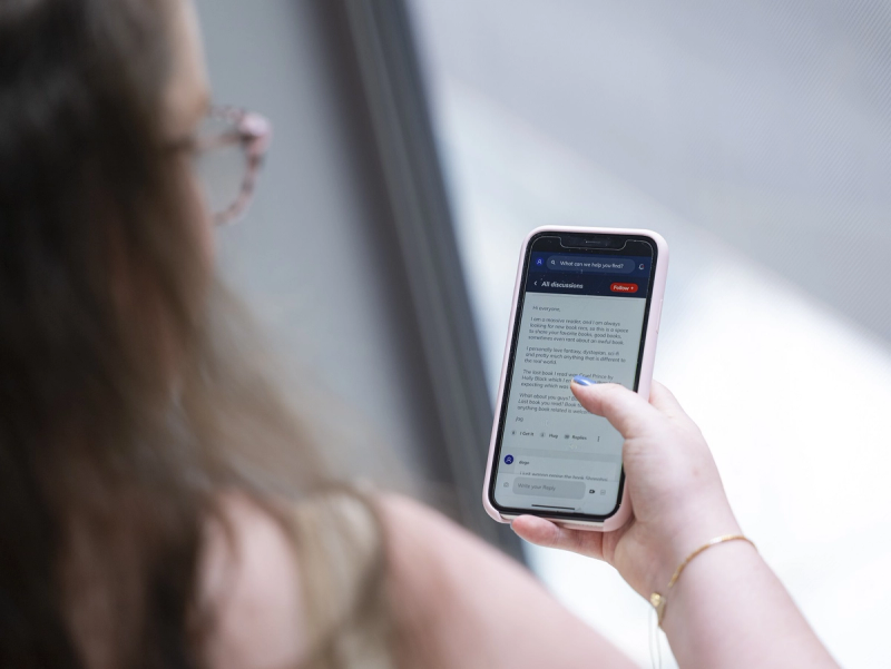 a woman is holding a cell phone that says all discussions on the screen