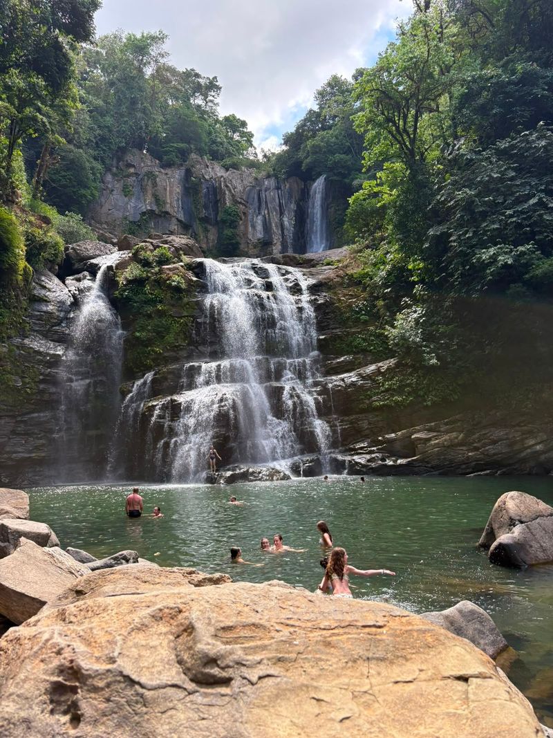 Water cascading through dense Costa Rican rainforest