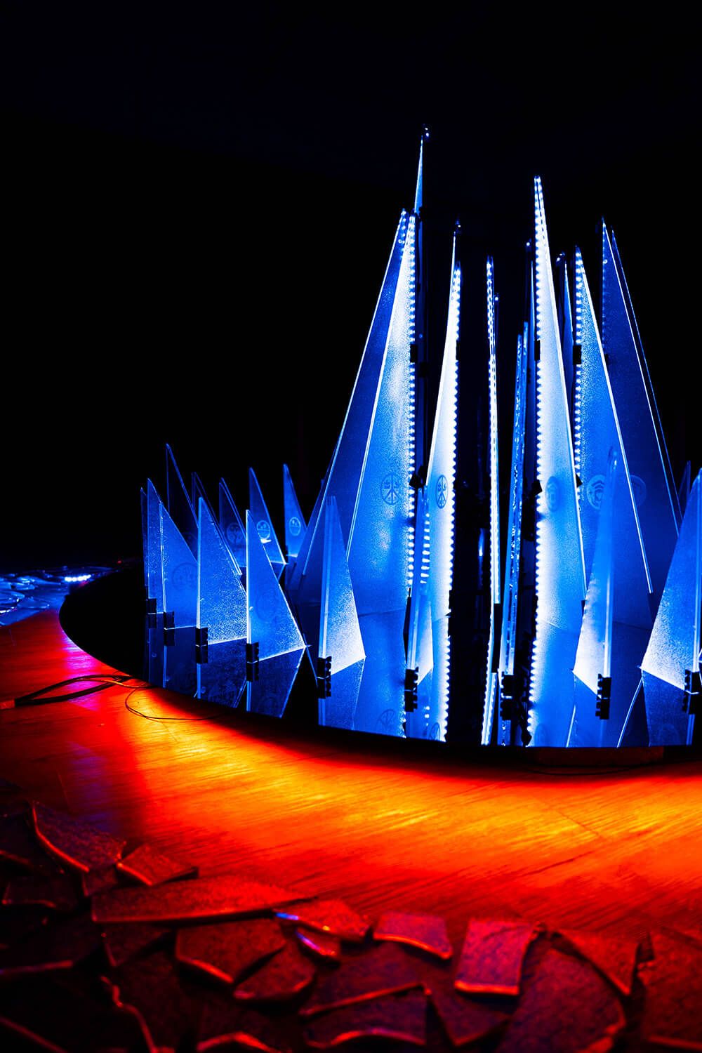 Visitor experiencing an illuminated artwork at IMMERSIO