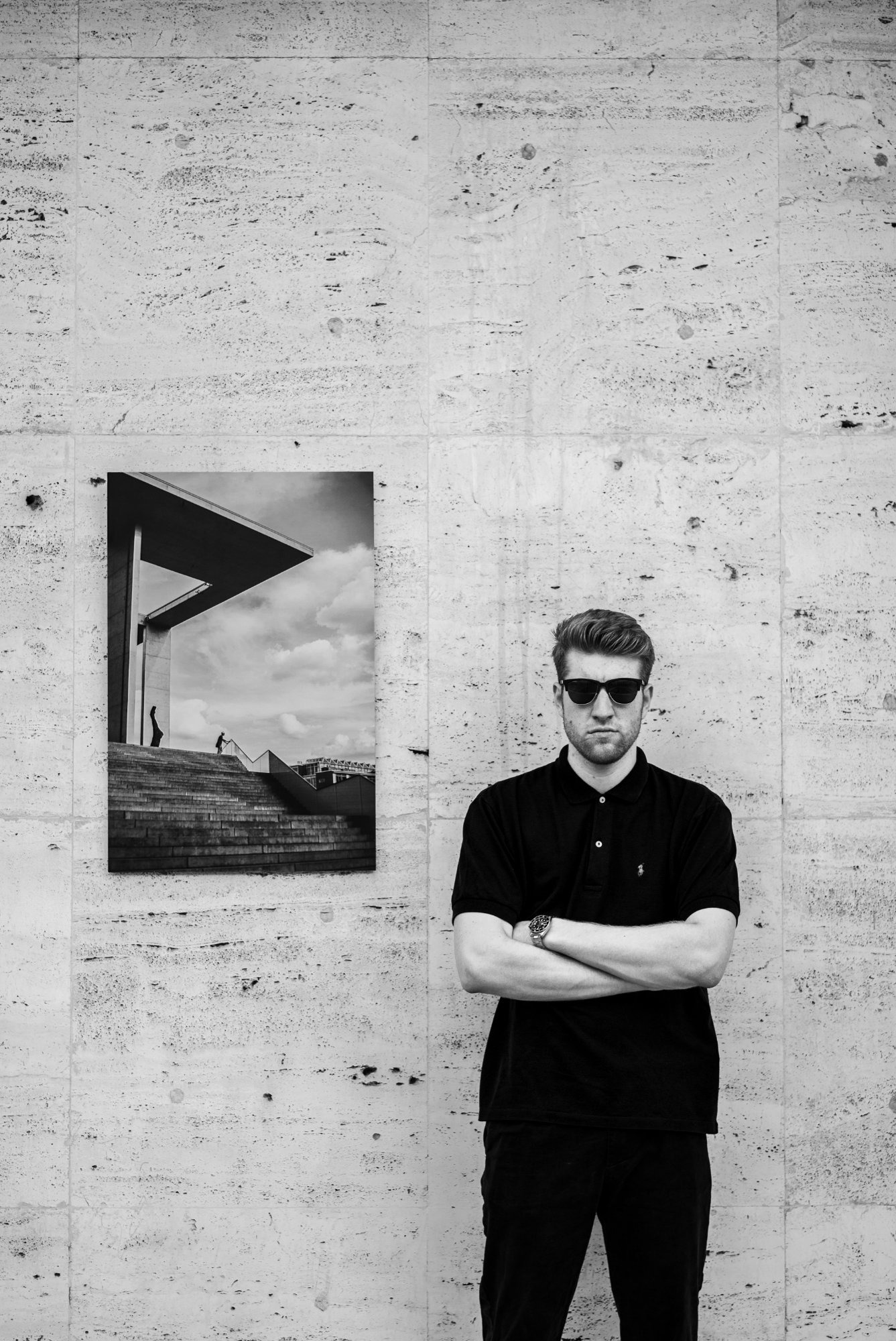 Jan standing next to his hung up artwork