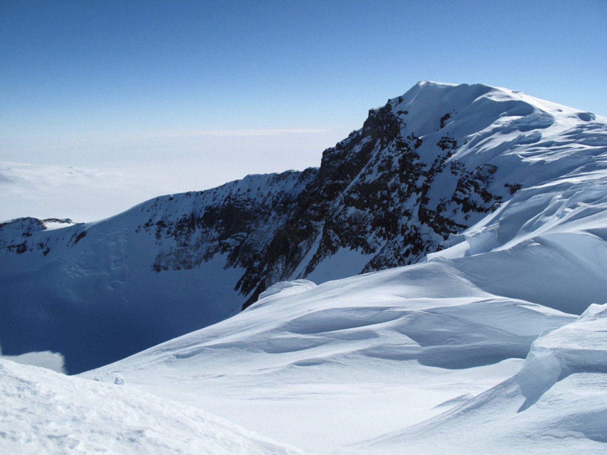 Snowy mountain peaks photo