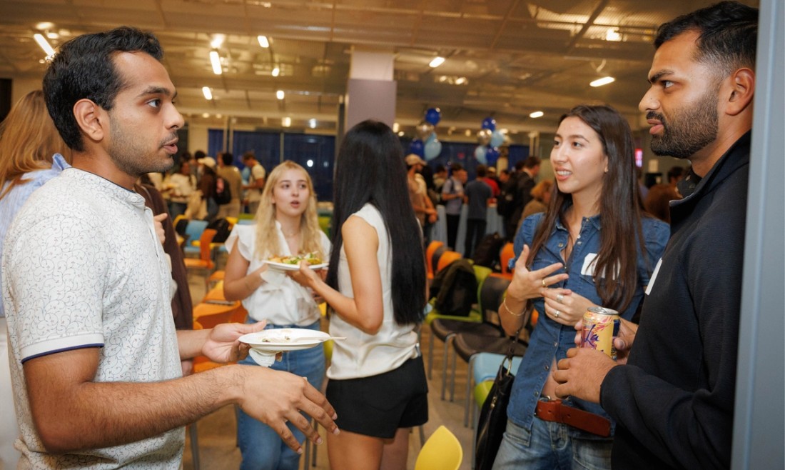 Columbia University students talking at campus exposition