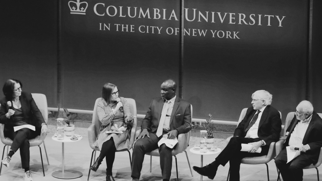 Panelists on a stage