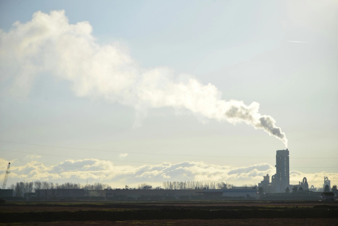 Smokestacks near a city