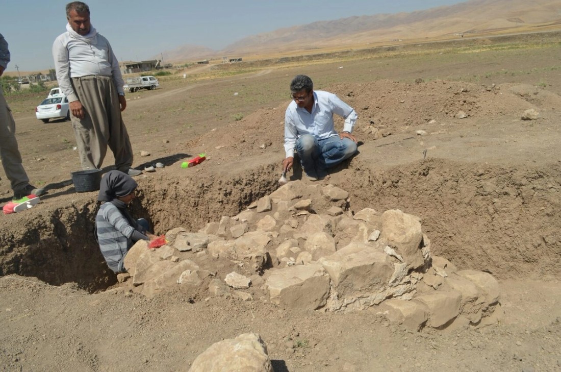 Archaeologists at a dig in the desert.