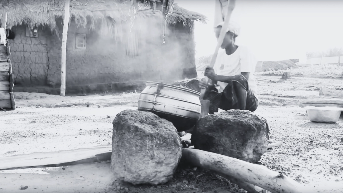 Woman cooking at a pot