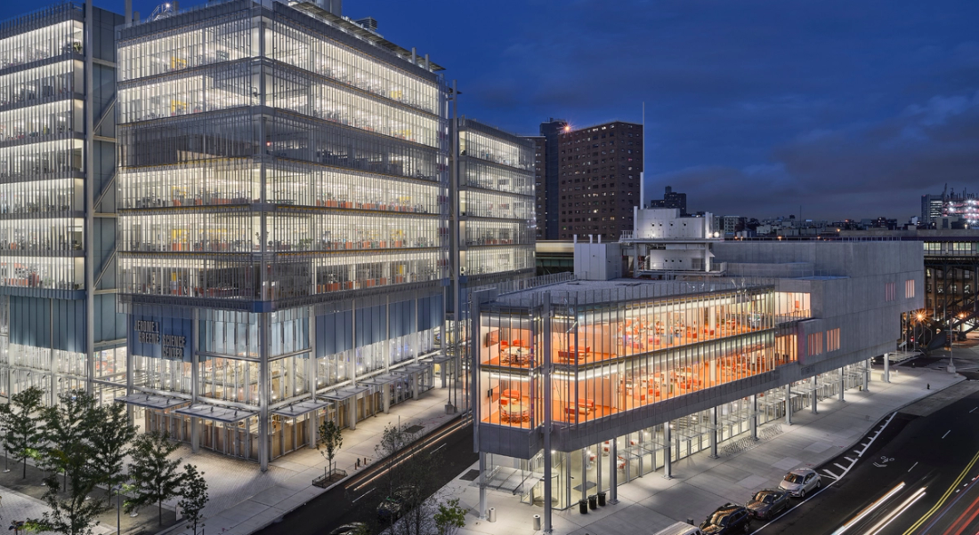 An exterior view of The Forum at Columbia University at night.