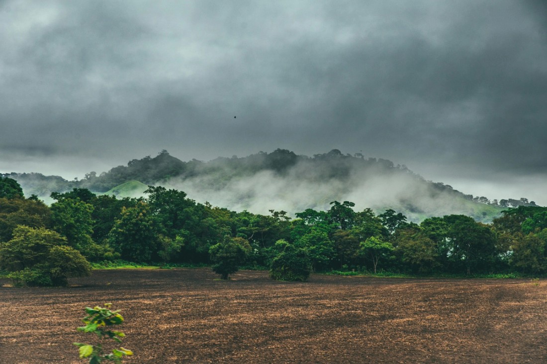 Green Hills And Blue Sky With Dramatic Clouds