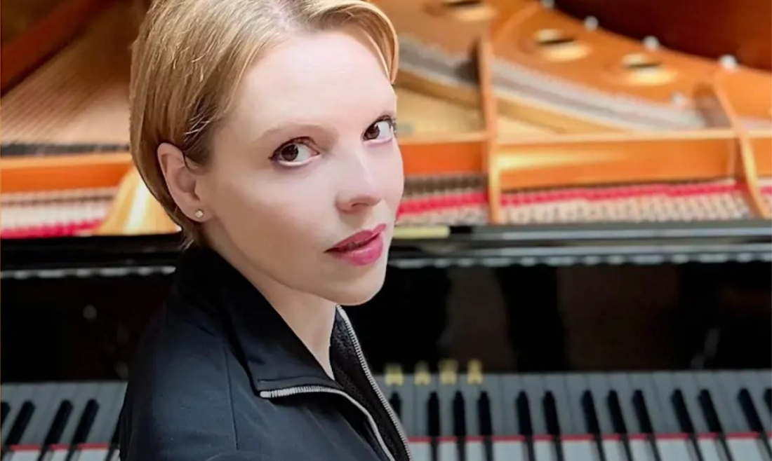 Magdalena Baczewska sitting in front of piano