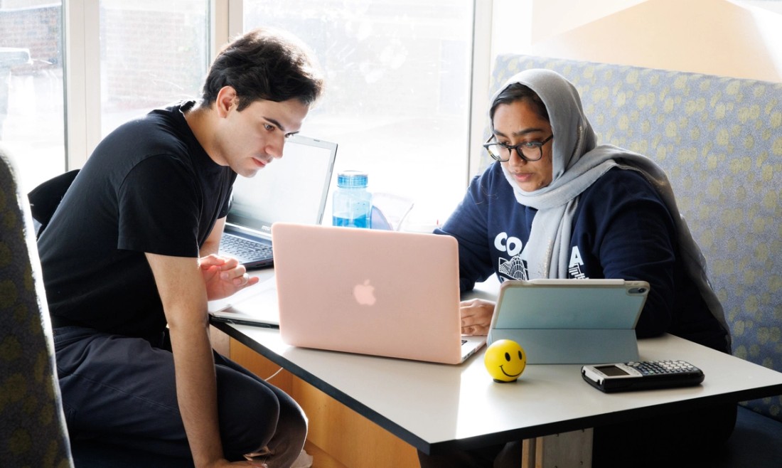 Two Columbia University students studying at table