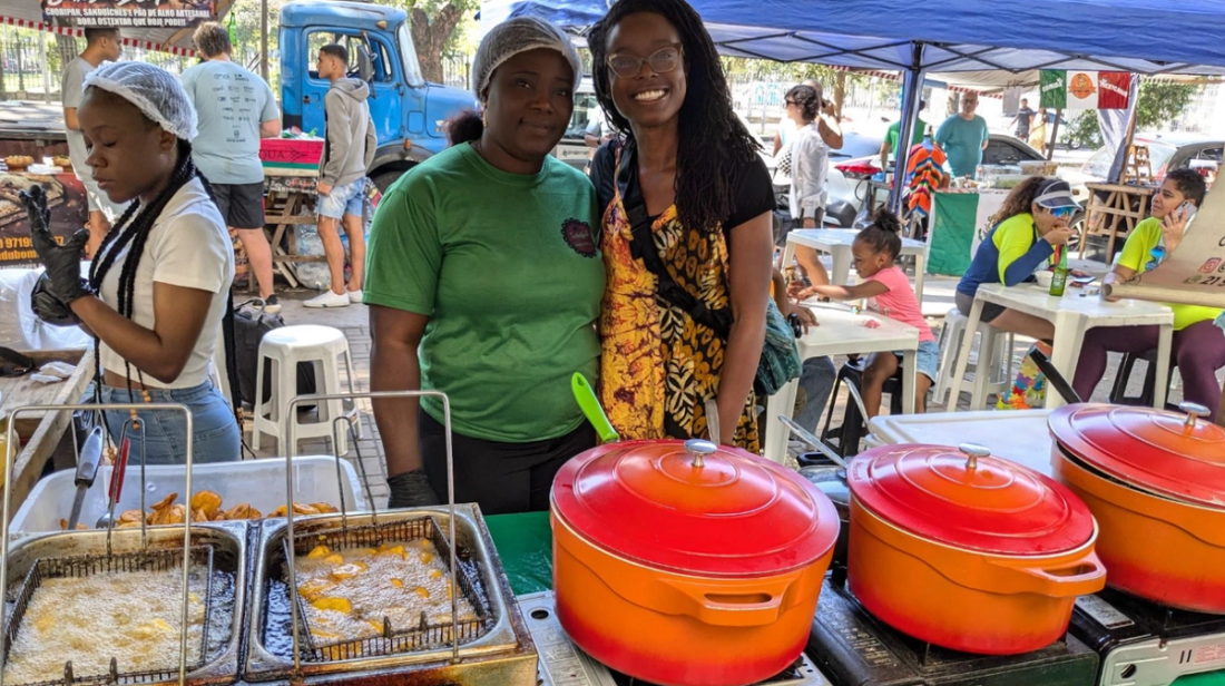 Picture of author (right) with Latifa (left); food vendor at the Feira specializing in Nigerian cuisine. 