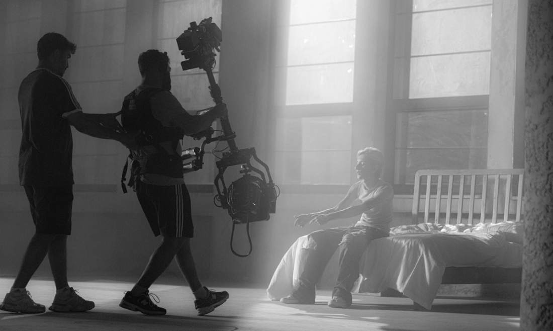 Two directors filming boy
