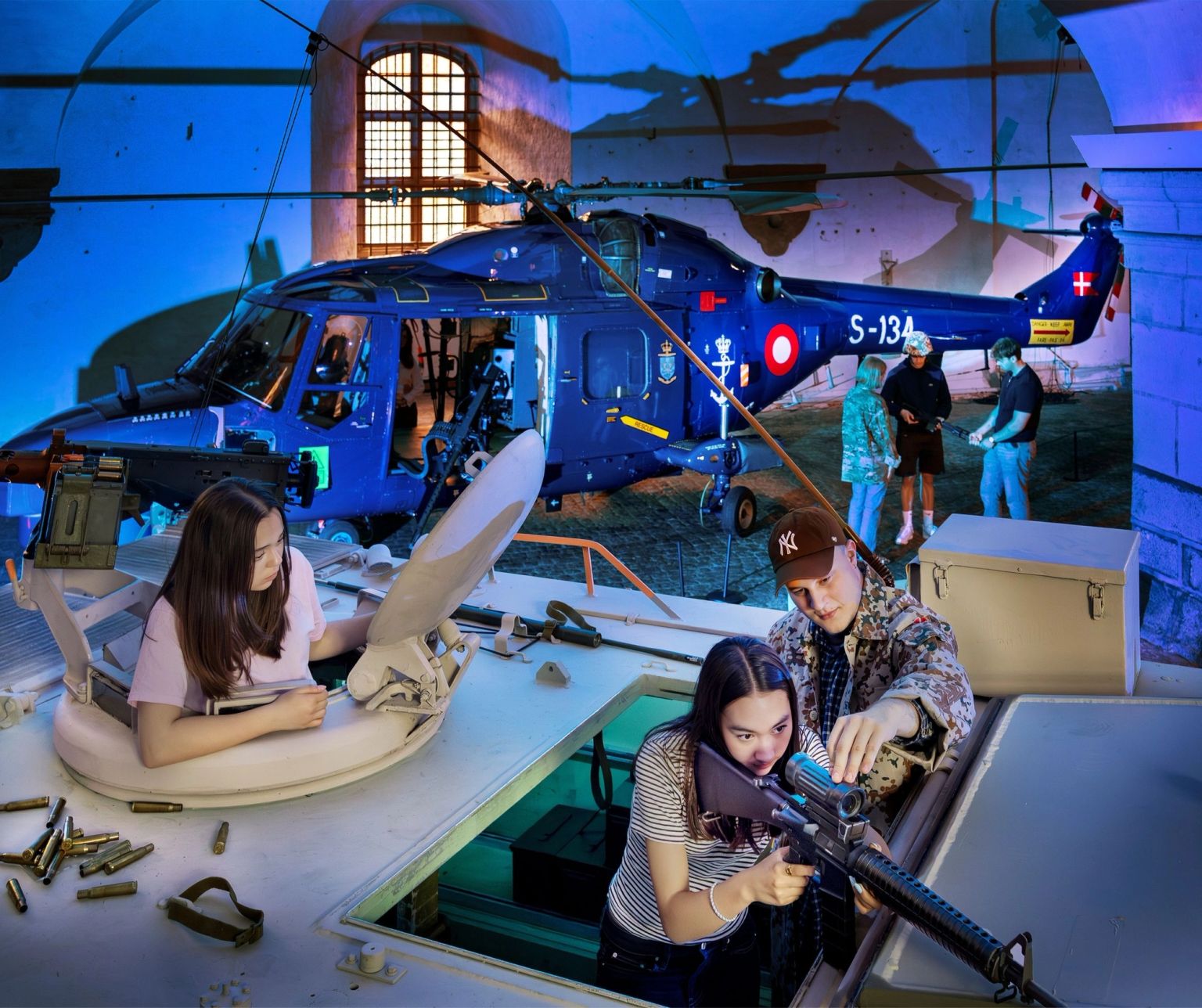 Guests sit behind the machine gun in the armoured personnel carrier.