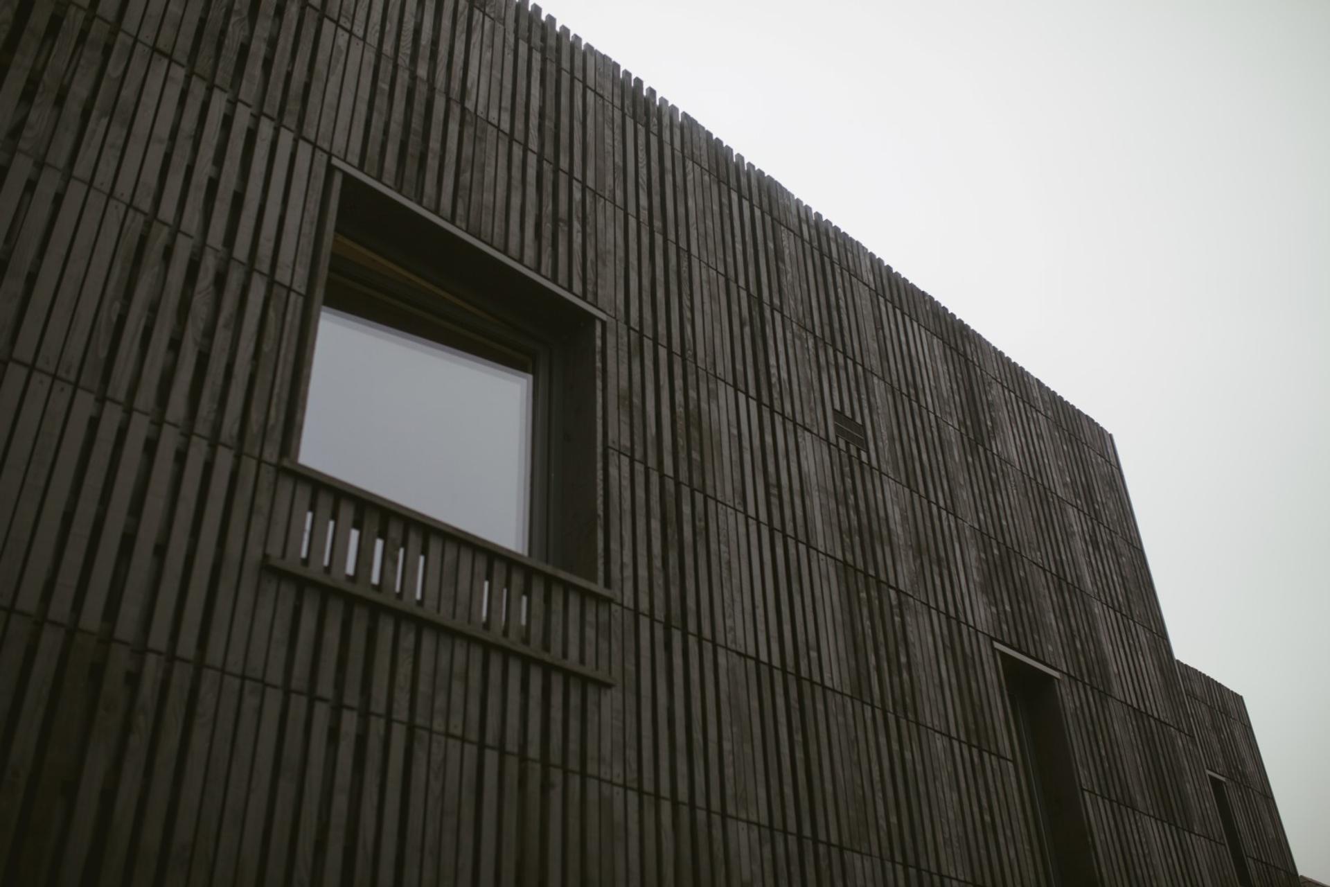This is an exterior photograph of Box House. It is made of U-Build in collaboration with Studio Bark and has been featured on the Grand Designs TV show.