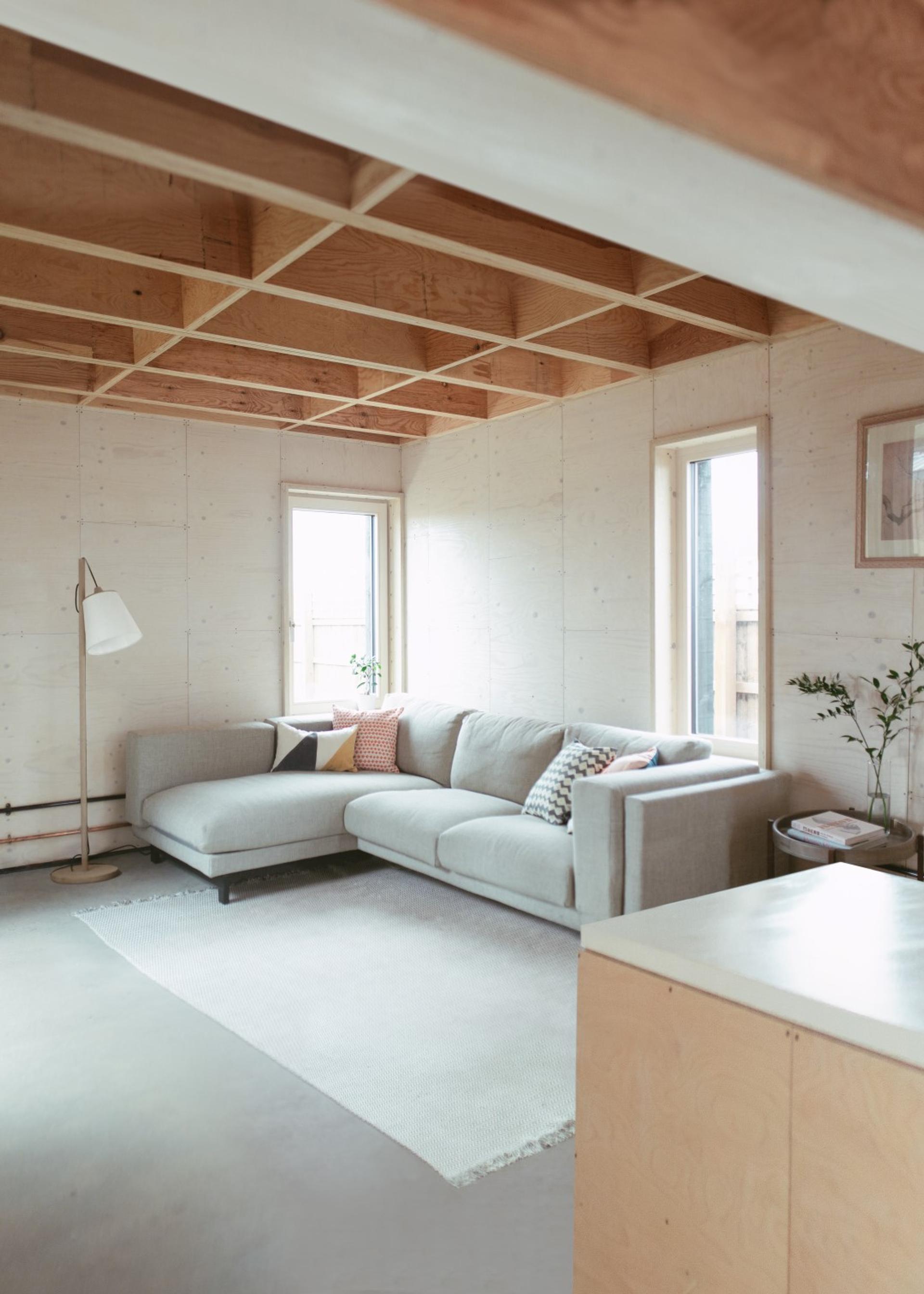This is an interior living room photograph of Box House. It is made of U-Build in collaboration with Studio Bark and has been featured on the Grand Designs TV show.