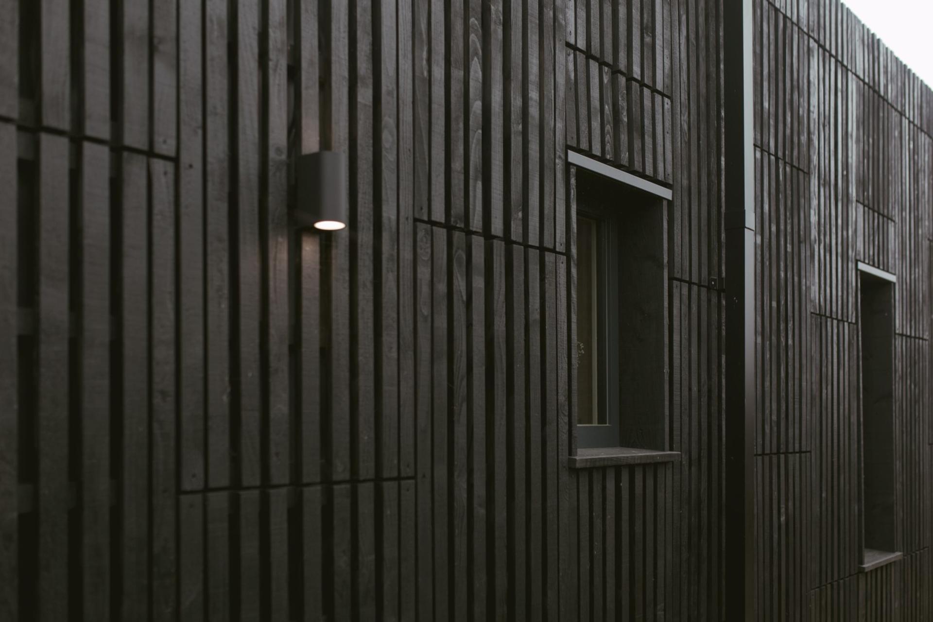 This is an exterior photograph of Box House. It is made of U-Build in collaboration with Studio Bark and has been featured on the Grand Designs TV show.
