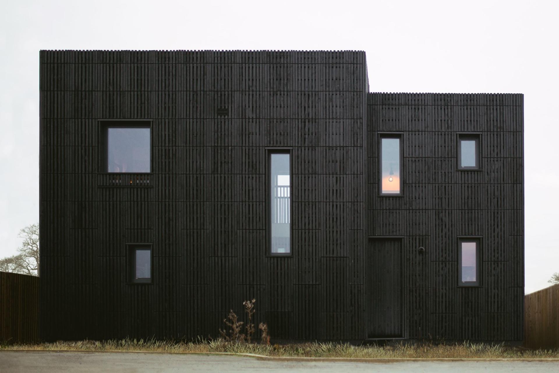 This is an exterior photograph of Box House. It is made of U-Build in collaboration with Studio Bark and has been featured on the Grand Designs TV show.