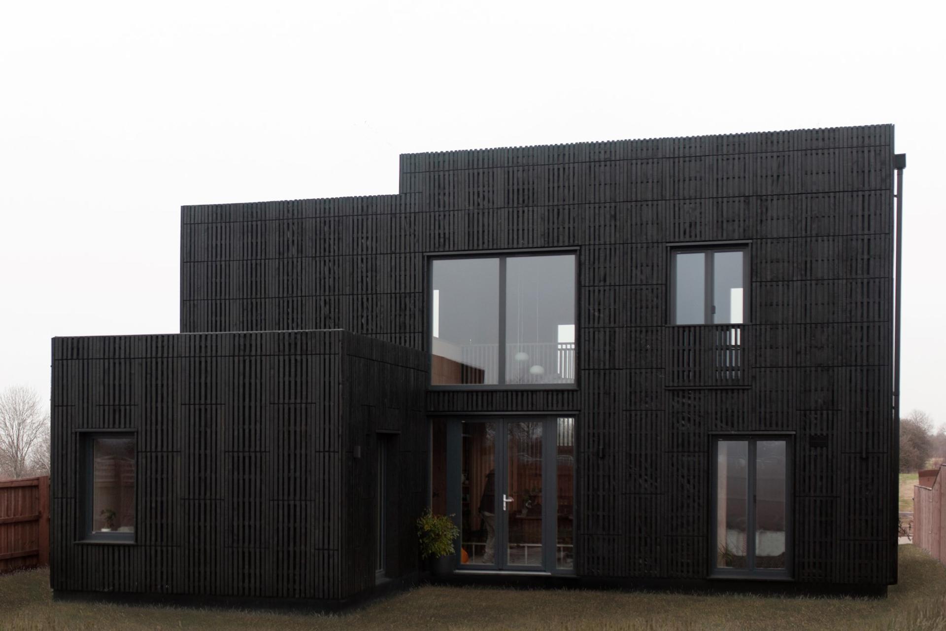 This is an exterior photograph of Box House. It is made of U-Build in collaboration with Studio Bark and has been featured on the Grand Designs TV show.