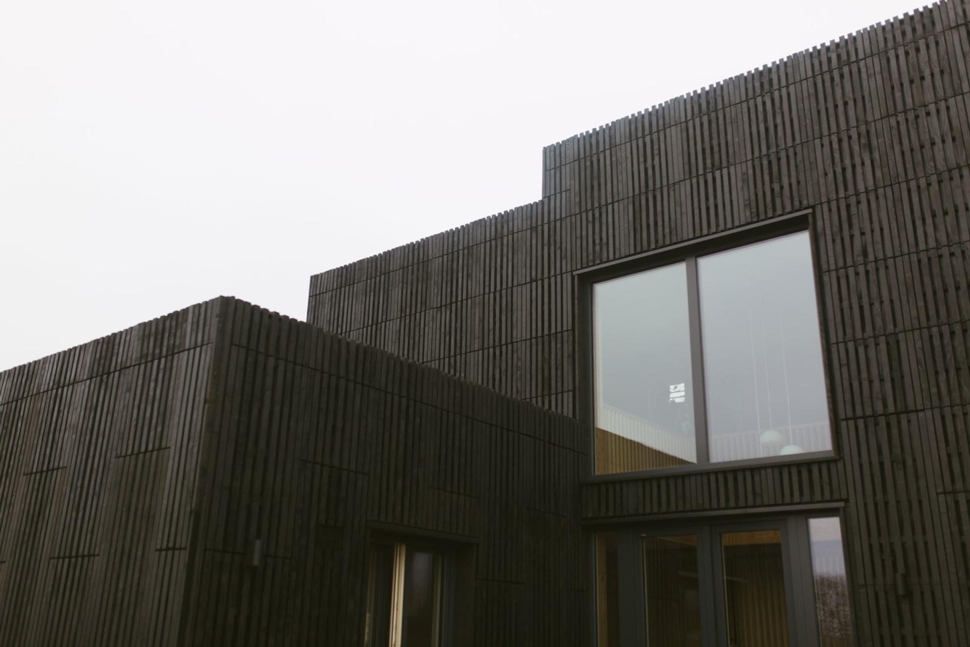 This is an exterior photograph of Box House. It is made of U-Build in collaboration with Studio Bark and has been featured on the Grand Designs TV show.