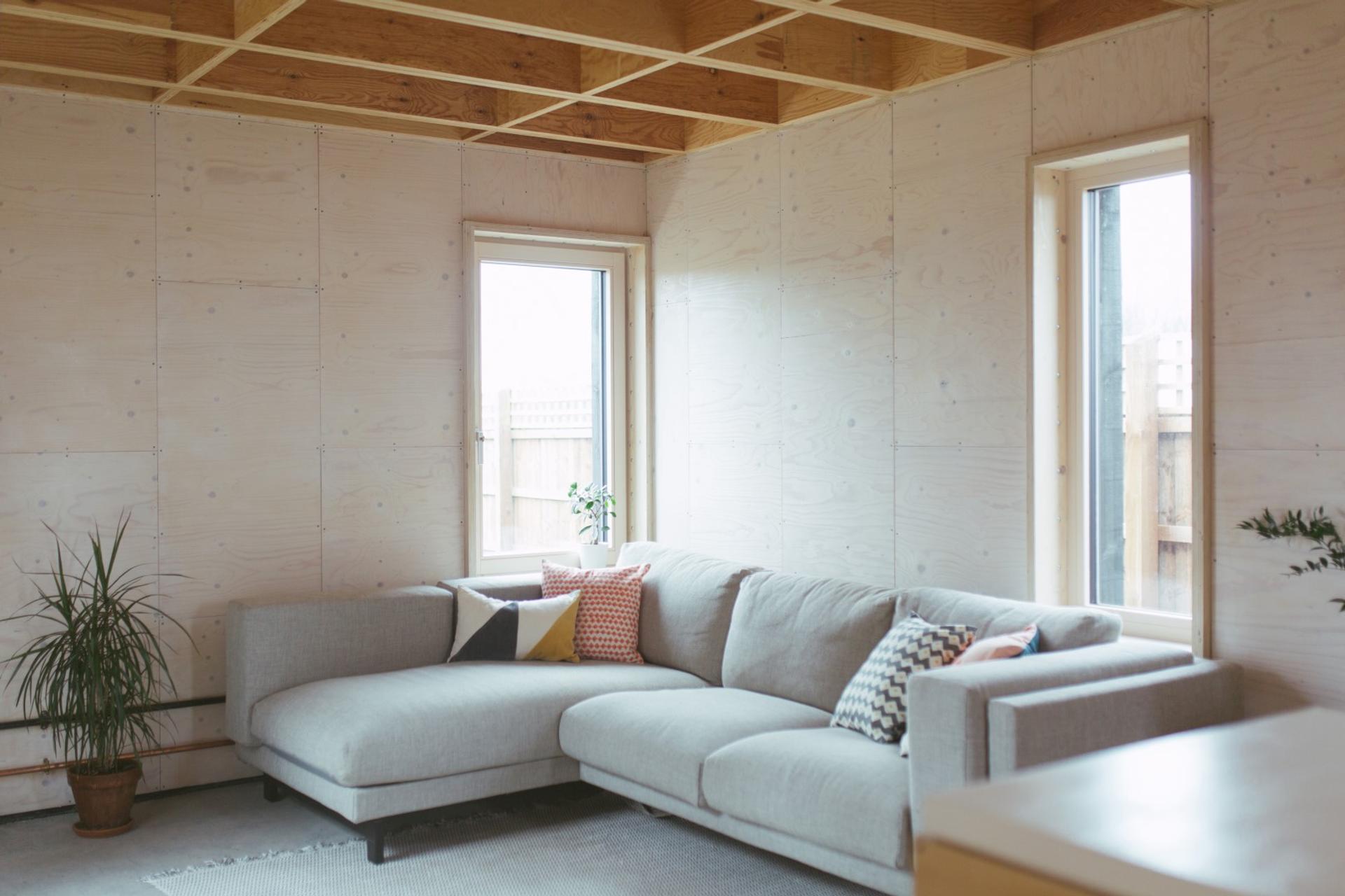 This is an interior living room photograph of Box House. It is made of U-Build in collaboration with Studio Bark and has been featured on the Grand Designs TV show.