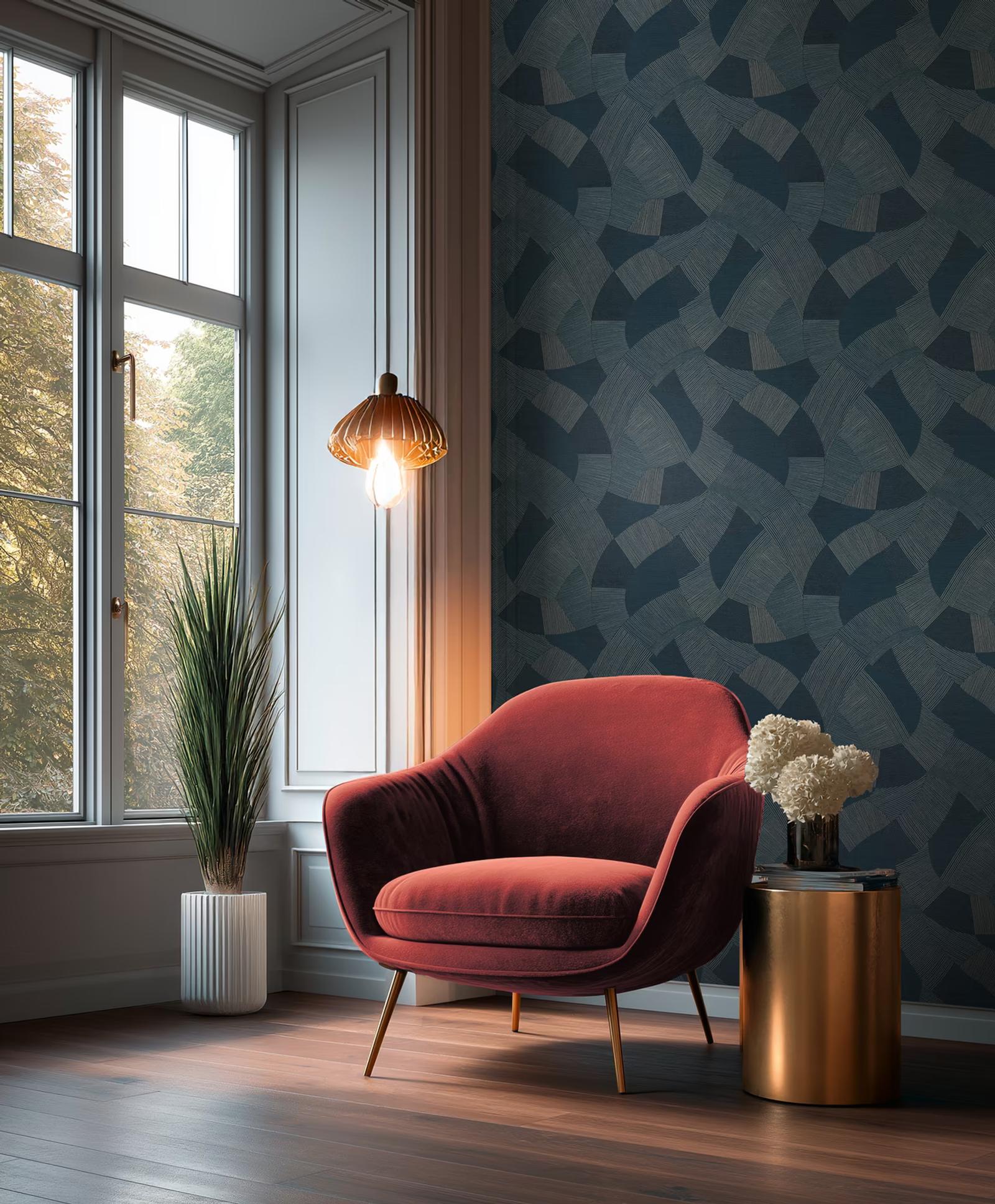 Navy Fan graphic wallpaper beside a window with a red velvet armchair