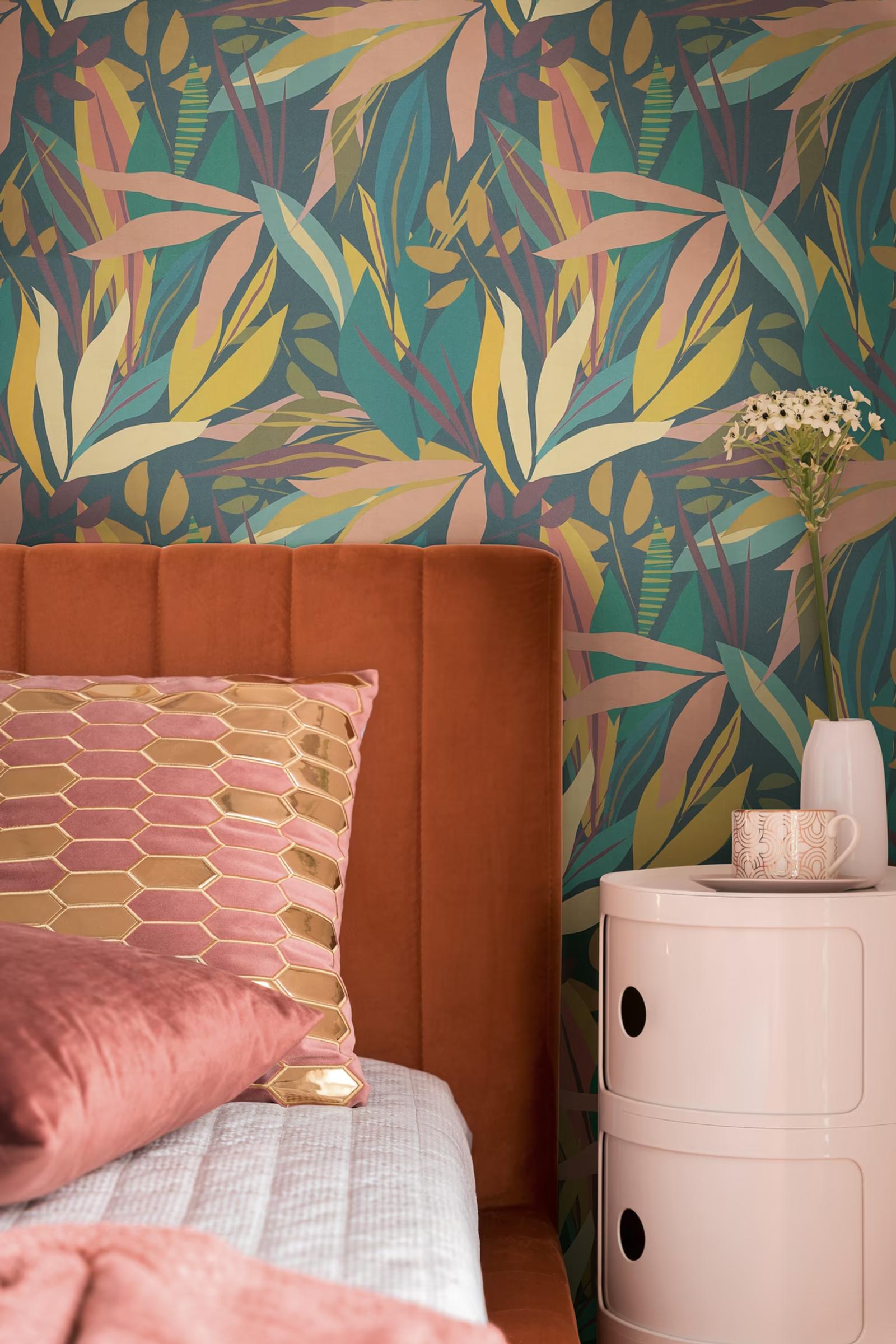 Midnight Palms wallpaper in a bedroom with a rust upholstered headboard