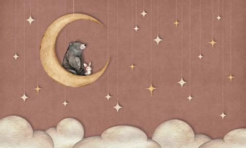 A bear and a small rabbit share a crescent moon beneath hanging paper stars.