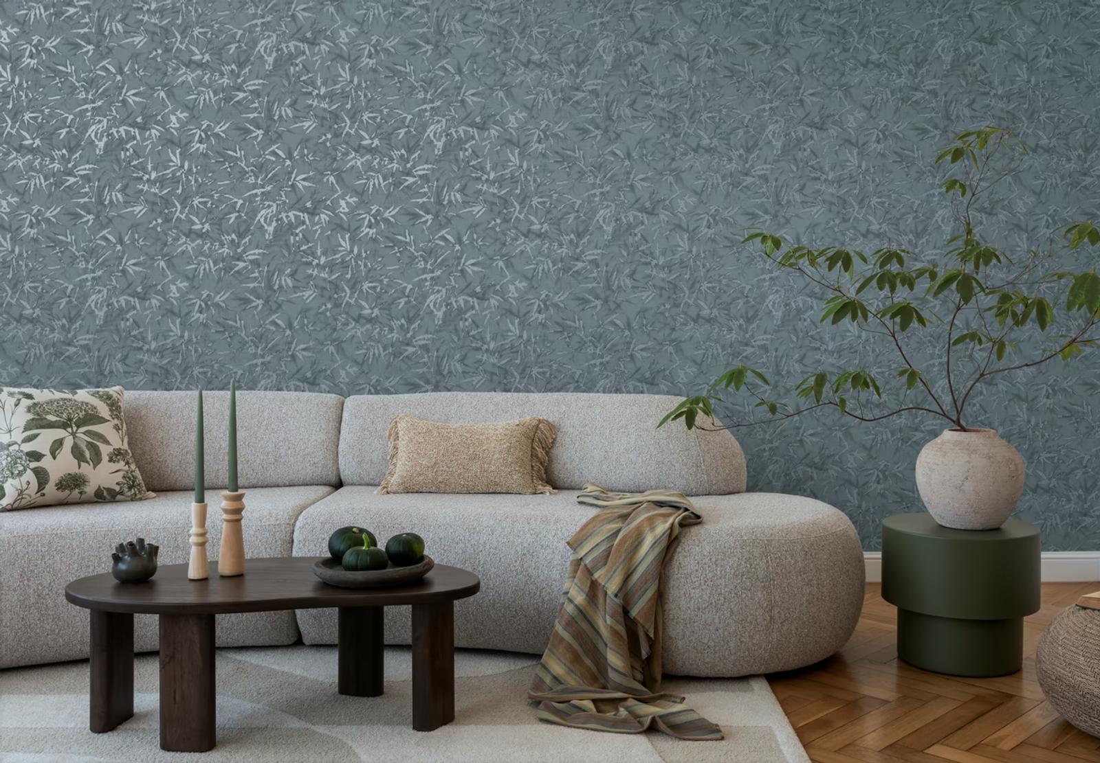 Slate Bamboo wallpaper behind a pale bouclé sofa and ottoman