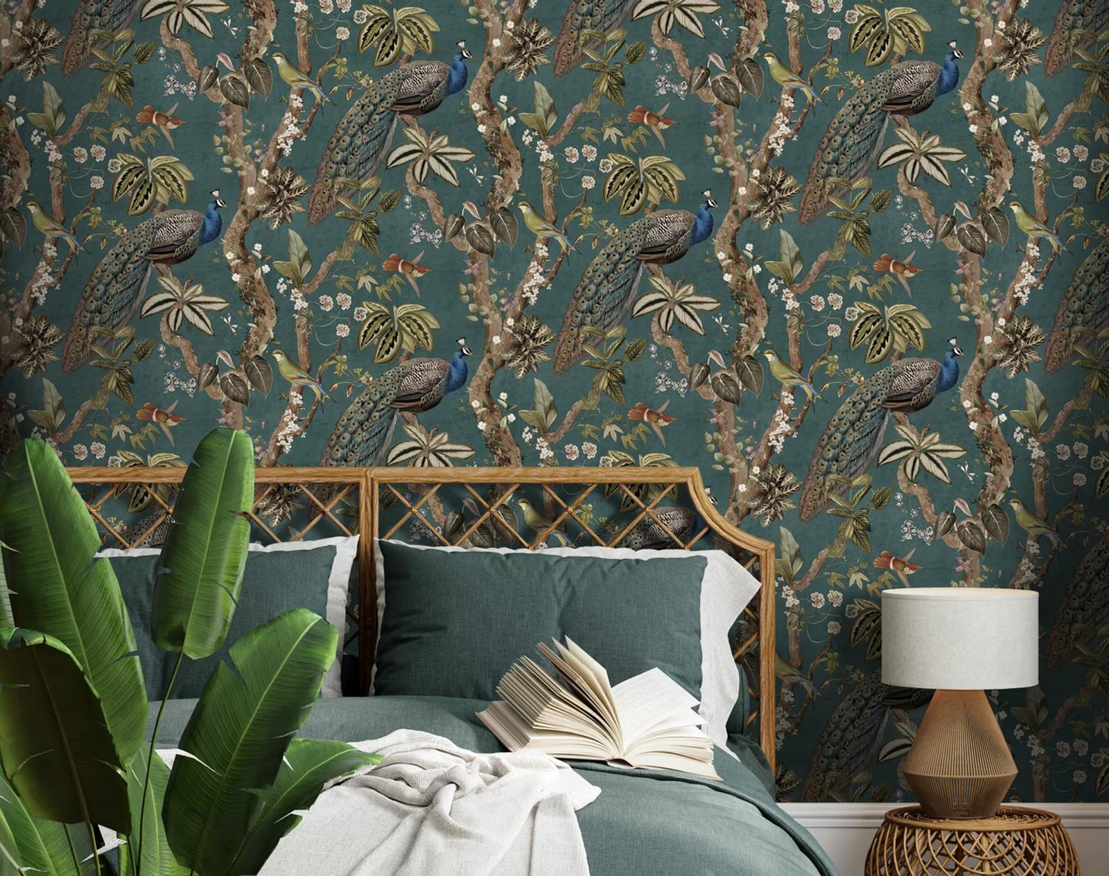 Cassia Aqua peacock wallpaper behind a rattan bed headboard