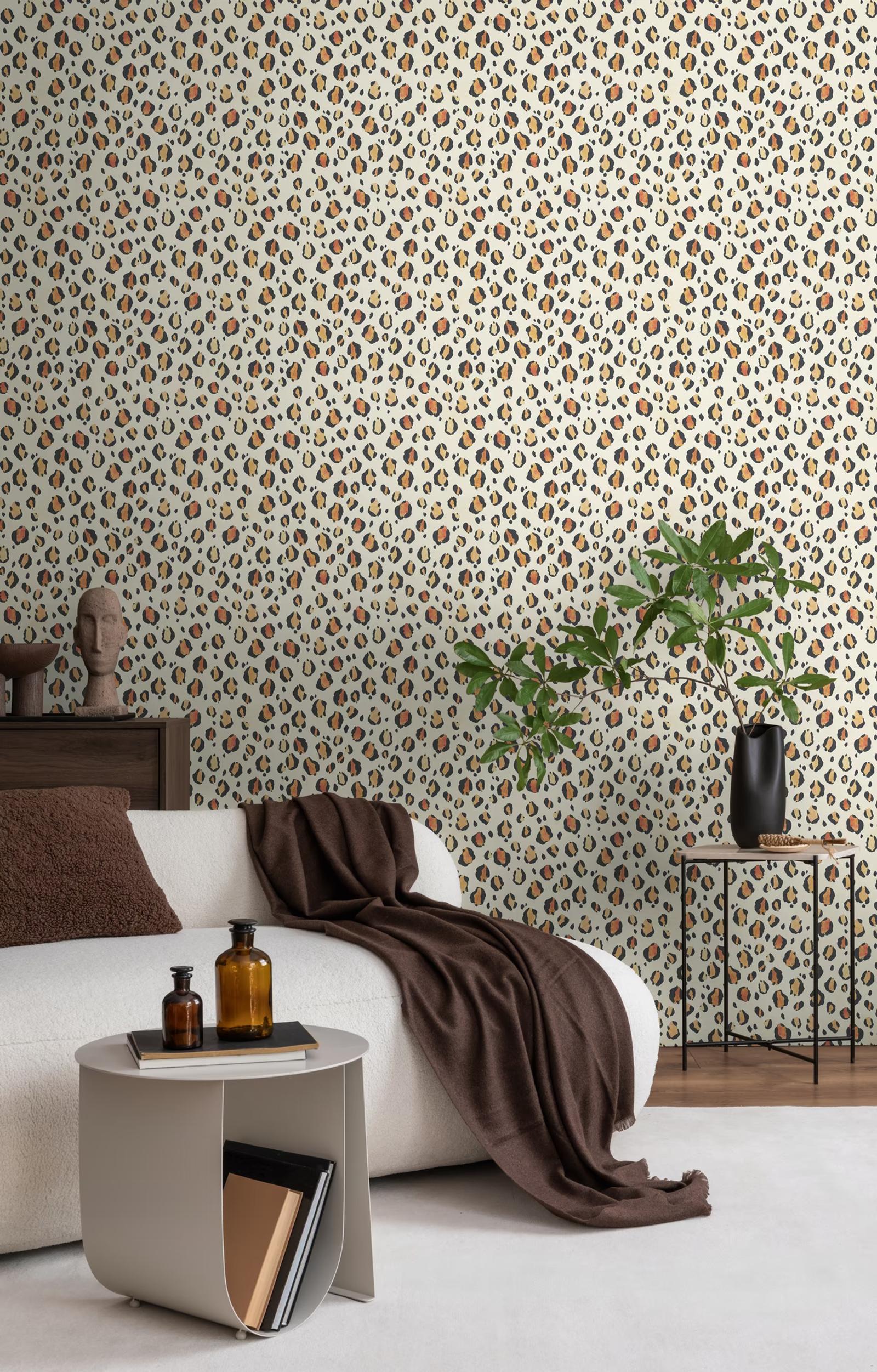 Cream Leopard wallpaper behind a bed with a chocolate throw