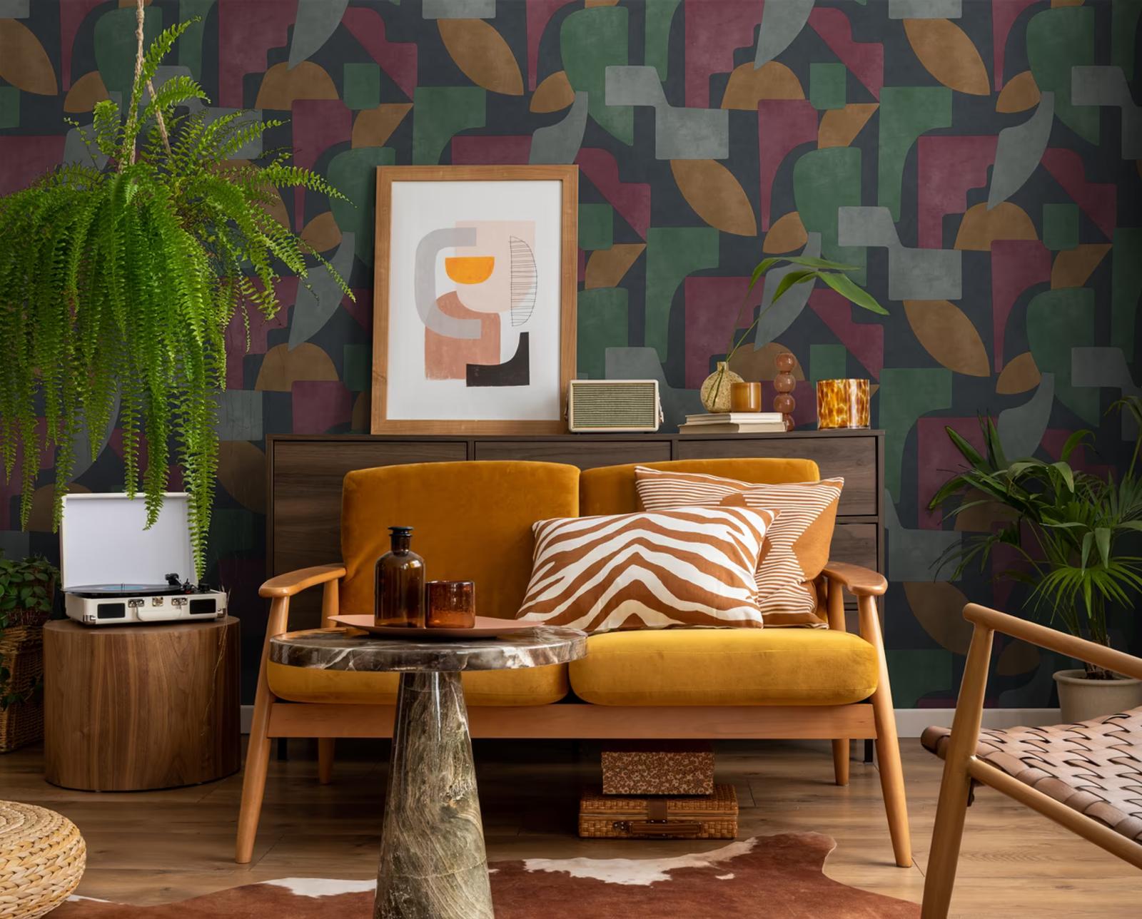 Linnet Navy Berry geometric wallpaper behind a mustard sofa