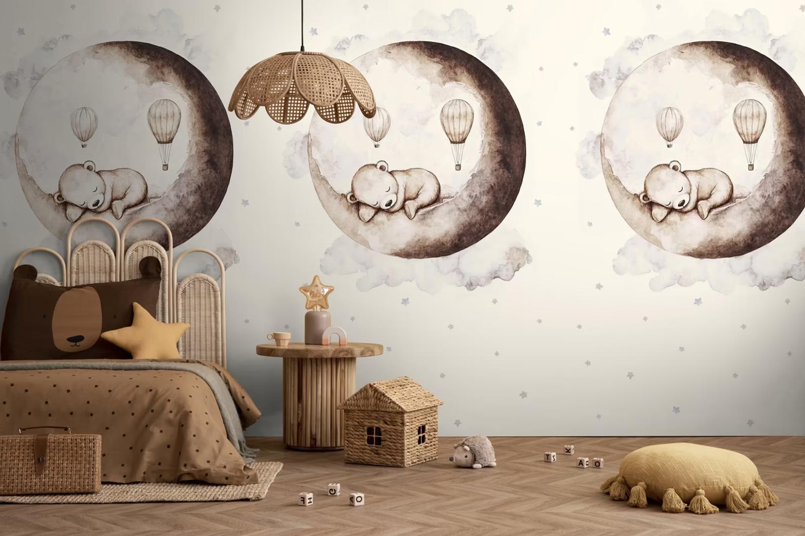 Moon Bear wall panel above a bed with a rattan pendant light