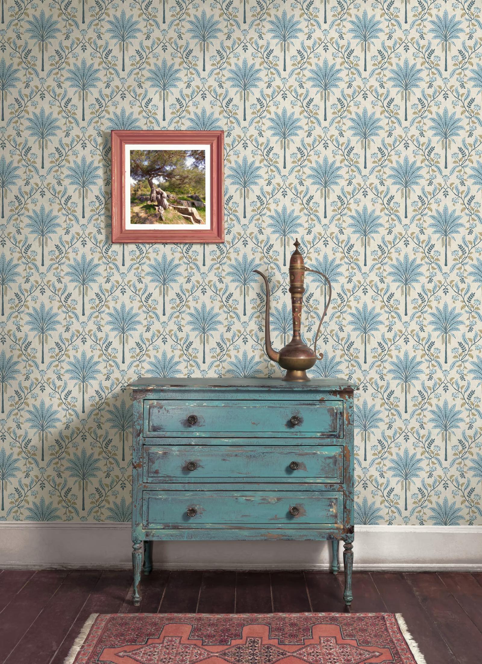Ariara Blue wallpaper behind a weathered blue dresser