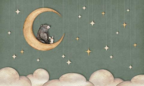 A bear and a small rabbit share a crescent moon beneath hanging paper stars.