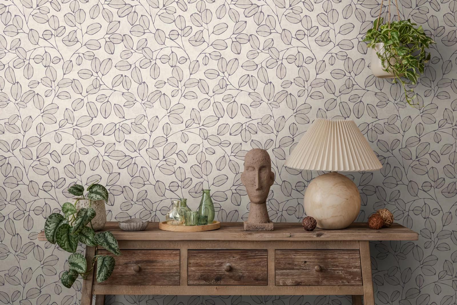 Taupe Eucalyptus wallpaper behind a rustic wooden console and stone bust