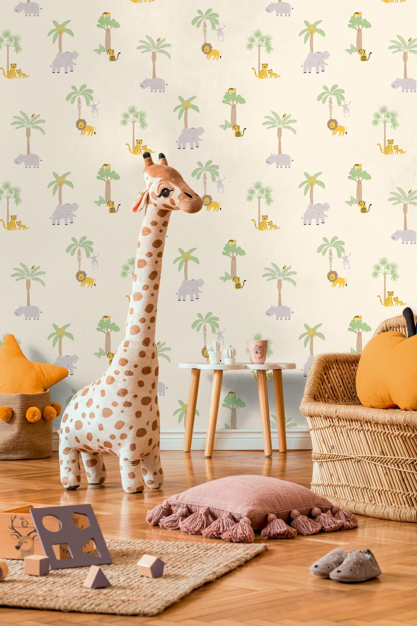 Cream Safari wallpaper in a playroom with a toy giraffe