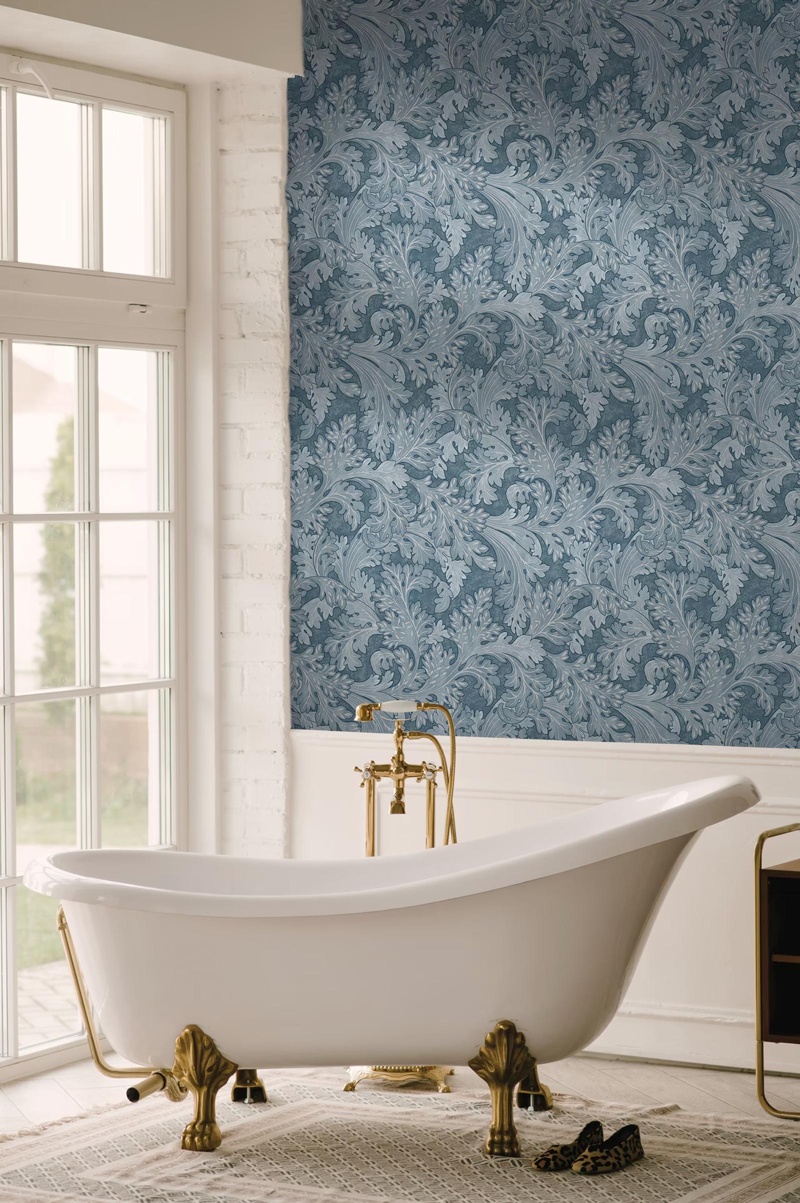 Forenza Navy leaf wallpaper in a bathroom with a freestanding bath