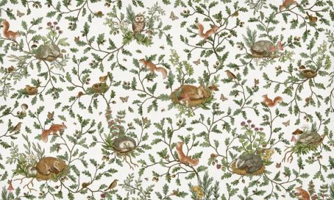 Woodland animals — rabbits, foxes and birds — dotted through leaves and berries in a fine all-over pattern. Shown on a clean white ground. Warm and storybook, it is a wall a child grows into.