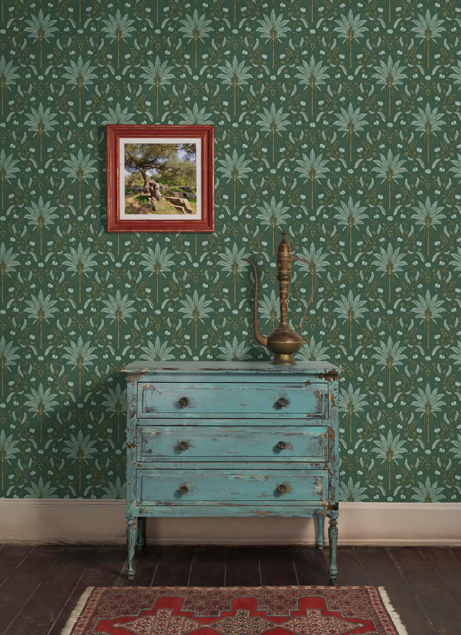 Ariara Green wallpaper behind a weathered blue dresser