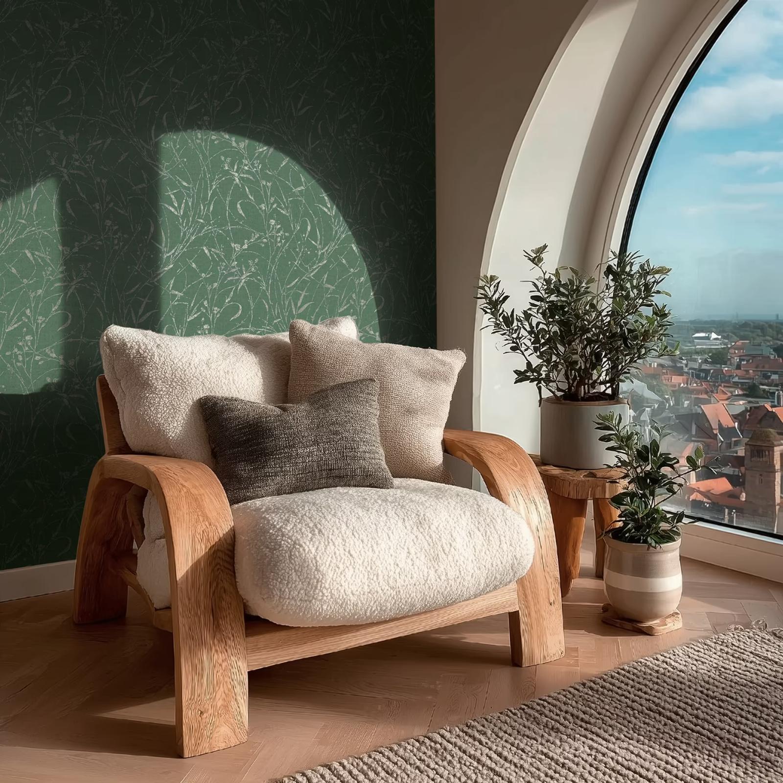 Forest Grasses wallpaper behind a curved timber armchair