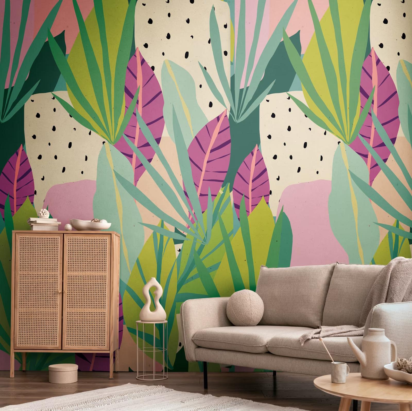 Jungle Cutout wall panel behind a linen sofa and cane cabinet