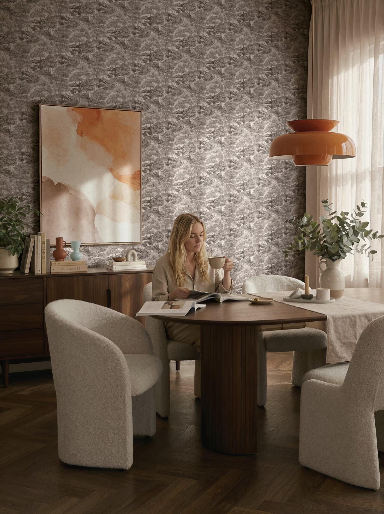 Grey Forest wallpaper in a dining room with bouclé chairs