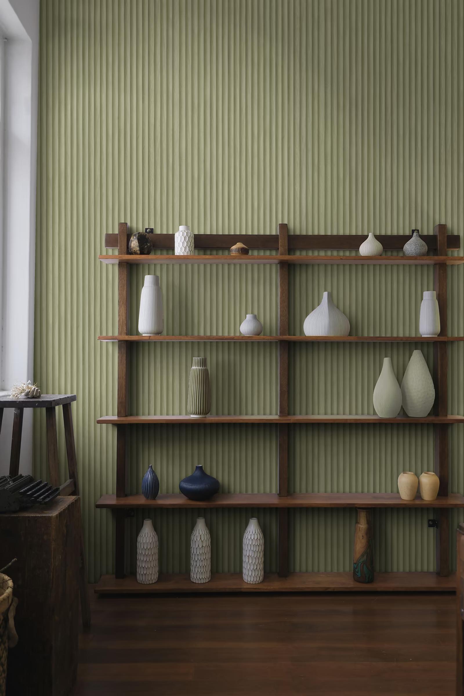 Teak Sage textured wallpaper behind a display shelf